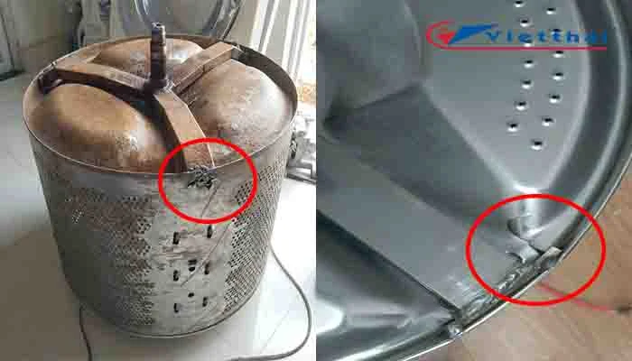 Chảng ba máy giặt inox xé rách lồng inox chỗ khoanh đỏ